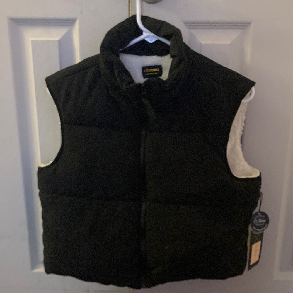 Black vest with tags on